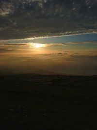 Scenic view of silhouette landscape against sky during sunset