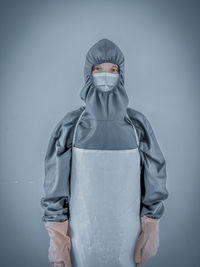 Woman wearing covid 19 ppe suit