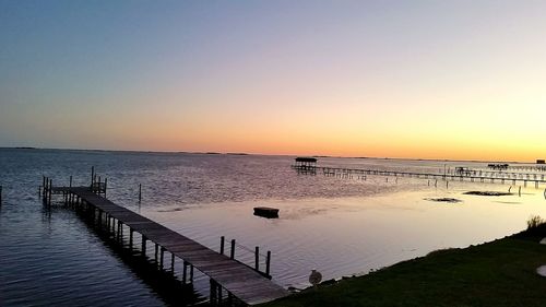 Scenic view of calm sea at sunset