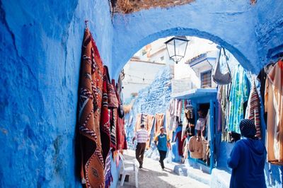 Silhouette of woman against blue sky