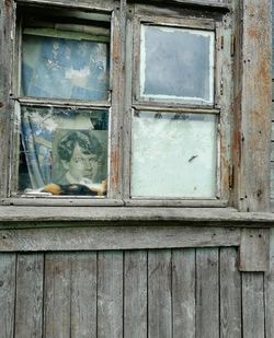 Broken window of abandoned house