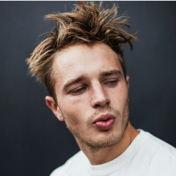 portrait, looking at camera, headshot, person, studio shot, young adult, front view, lifestyles, close-up, head and shoulders, leisure activity, human face, young men, serious, indoors, contemplation, confidence