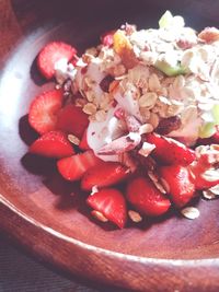 High angle view of chopped fruits in plate on table