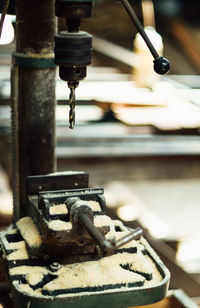 Close-up of old machinery at factory
