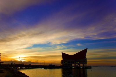 Scenic view of sea against orange sky