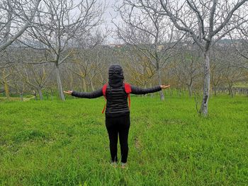 Full length of woman standing on field