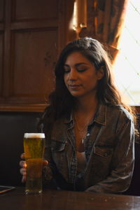 Close-up of a young woman drinking glasses