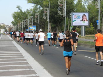 People walking on road in city