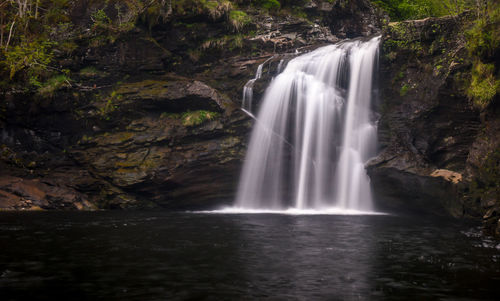 Scenic view of waterfall in forest