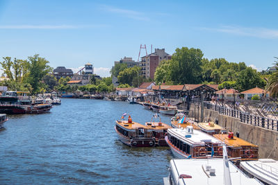 Boats moored at harbor