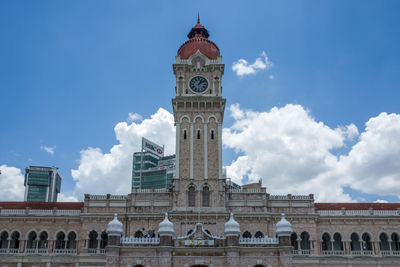 Low angle view of cathedral against cloudy sky