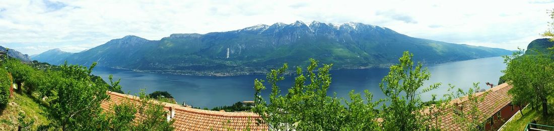 Scenic view of mountains against cloudy sky