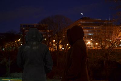 Friends against sky at night