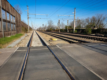 Railroad tracks against clear sky