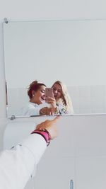 Portrait of a smiling young woman in bathroom