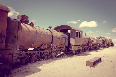 Train on railroad track against sky