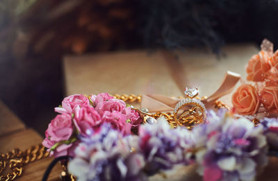 Close-up of pink roses on table