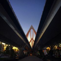 Low angle view of bridge against sky at night