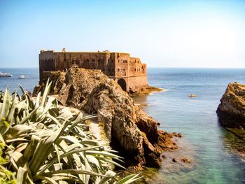 Scenic view of sea against clear sky