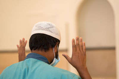 Muslim man praying in the mosque