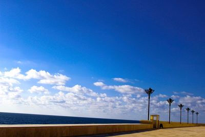 Scenic view of sea against blue sky