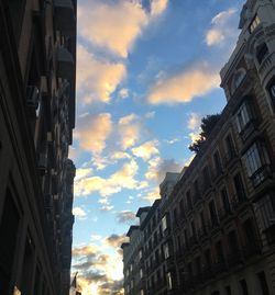 Low angle view of buildings against sky during sunset