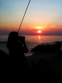 Scenic view of sea at sunset