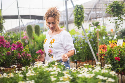 Woman working in greenhouse