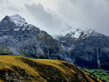 Panoramic view of snowcapped mountains against sky