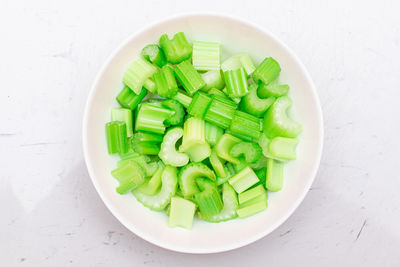 High angle view of chopped vegetables in bowl on table