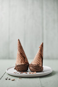 Close-up of ice cream cone on table