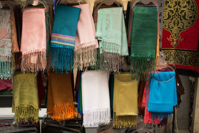 Clothes hanging in market stall for sale