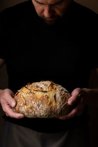 Midsection of man holding food