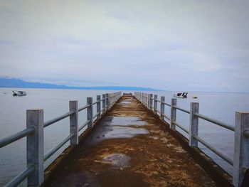 Pier over sea against sky