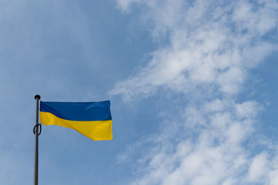 Low angle view of flag against sky