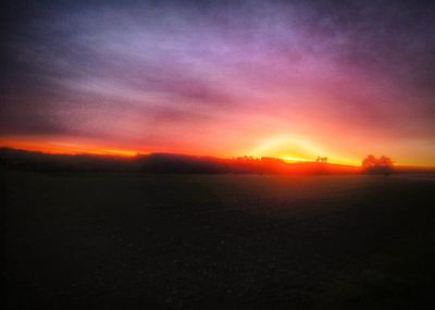 Scenic view of dramatic sky during sunset