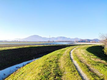 Scenic view of landscape against clear blue sky