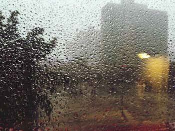 Full frame shot of raindrops on glass window