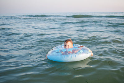 Portrait of man swimming in sea