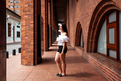 Beautiful young woman at the historical center of the city of cali in colombia