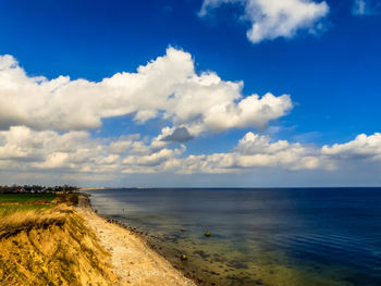 Scenic view of sea against blue sky