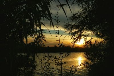 Scenic view of sunset over lake