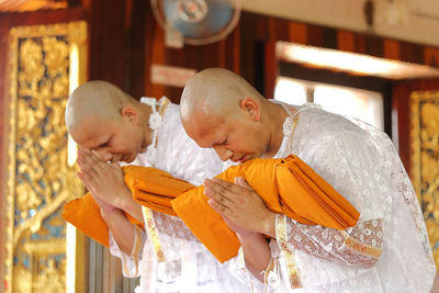 Monks having ordination ceremony at temple
