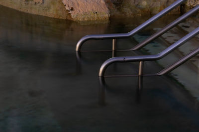 Close-up of empty seats in water