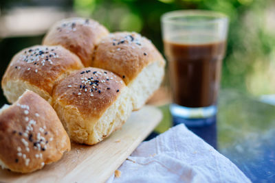 Close-up of bread on cutting board at table