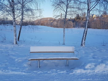 Close-up of frozen lake against sky during winter