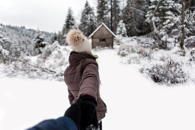 Rear view of girl in snow