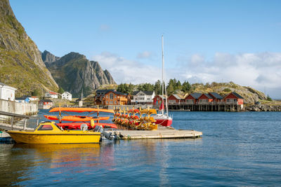 Boats in sea against clear sky