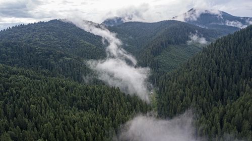 Scenic view of waterfall against sky