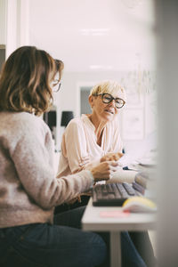 Two businesswomen at home office having a discussion